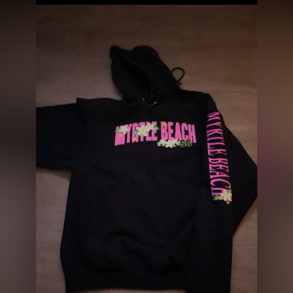 Never been used it’s black and says Myrtle Beach on it